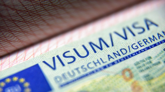 Close-up of a German Schengen visa in a passport, relevant for entry to the EU.