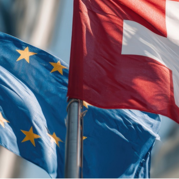EU and Swiss flags as a symbol of customs when moving from Switzerland to Germany